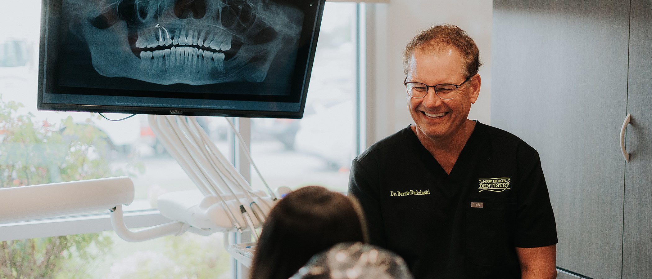 Dr. Bernie chatting with patient